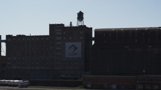 DX0002_201_035 - 5.7K aerial stock footage of a flour mill and water tower in Buffalo, New York