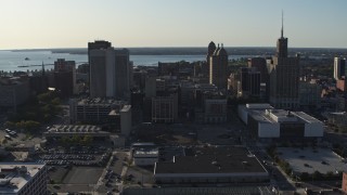 DX0002_203_015 - 5.7K aerial stock footage of ascending past three tall office towers in Downtown Buffalo, New York