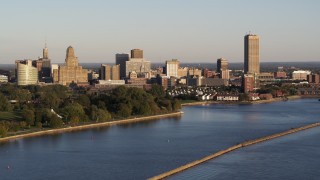 DX0002_203_033 - 5.7K aerial stock footage of the city's skyline at sunset, seen from Lake Erie, Downtown Buffalo, New York