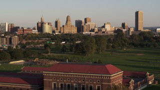 DX0002_203_037 - 5.7K aerial stock footage ascend over water filtration plant to approach city hall and skyline at sunset, Downtown Buffalo, New York