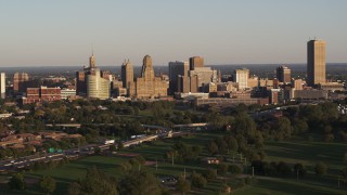 DX0002_203_038 - 5.7K aerial stock footage of city hall and skyline at sunset, Downtown Buffalo, New York