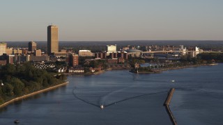 DX0002_203_041 - 5.7K aerial stock footage of Seneca One Tower and Buffalo River at sunset, Downtown Buffalo, New York