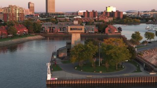 DX0002_204_020 - 5.7K aerial stock footage orbit a lakeside observation deck at sunset, Buffalo, New York