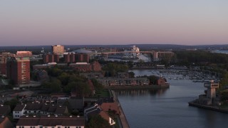 DX0002_204_027 - 5.7K aerial stock footage of a wide view of the Buffalo Skyway behind marina at sunset, Downtown Buffalo, New York