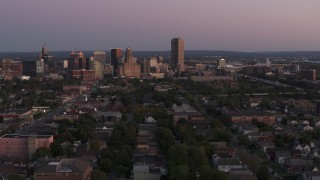 DX0002_204_030 - 5.7K aerial stock footage of Seneca One Tower and the city's skyline at twilight, Downtown Buffalo, New York