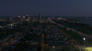 DX0002_204_055 - 5.7K aerial stock footage descending with view of Seneca One Tower and skyline at twilight, Downtown Buffalo, New York
