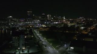 DX0002_205_008 - 5.7K aerial stock footage of a reverse view of the skyline at night, Downtown Buffalo, New York