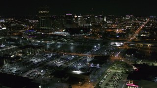 DX0002_205_010 - 5.7K aerial stock footage of flying toward and past the skyline at night, Downtown Buffalo, New York
