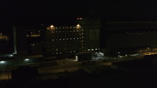 DX0002_205_023 - 5.7K aerial stock footage of a flour mill at night, Buffalo, New York
