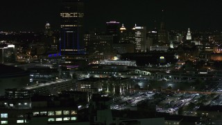 DX0002_205_033 - 5.7K aerial stock footage of the skyline seen while passing parking lots at night, Downtown Buffalo, New York