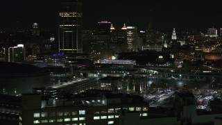 DX0002_205_034 - 5.7K aerial stock footage of flying by the skyline seen from parking lots at night, Downtown Buffalo, New York