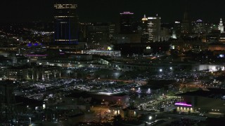 DX0002_205_035 - 5.7K aerial stock footage of passing by the skyline seen from parking lots at night, Downtown Buffalo, New York
