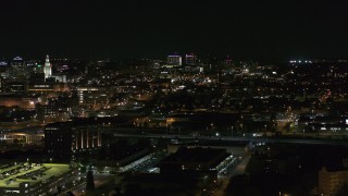 DX0002_205_036 - 5.7K aerial stock footage of a wide view of Buffalo General Medical Center at night, Downtown Buffalo, New York