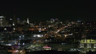 DX0002_205_038 - 5.7K aerial stock footage of distant Buffalo General Medical Center at night, Downtown Buffalo, New York