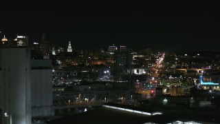 DX0002_205_039 - 5.7K aerial stock footage of distant Buffalo General Medical Center seen from grain elevators at night, Downtown Buffalo, New York