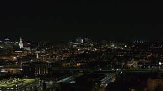 DX0002_205_041 - 5.7K aerial stock footage of distant Buffalo General Medical Center at night during descent, Downtown Buffalo, New York