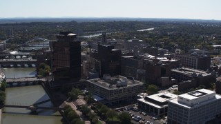 DX0002_206_012 - 5.7K aerial stock footage stationary view of office buildings by the Genessee River, Downtown Rochester, New York