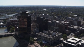 DX0002_206_013 - 5.7K aerial stock footage of office buildings and hotel by the Genessee River, Downtown Rochester, New York