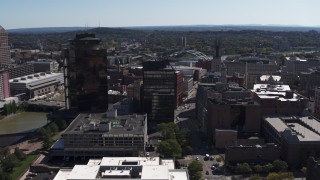 DX0002_206_017 - 5.7K aerial stock footage focus on riverfront office towers during descent, Downtown Rochester, New York