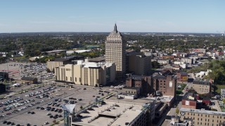 DX0002_206_021 - 5.7K aerial stock footage ascend away from Kodak Tower and Monroe Community College, Rochester, New York