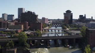 DX0002_206_035 - 5.7K aerial stock footage fly over falls and river bridges toward First Federal Plaza, Downtown Rochester, New York