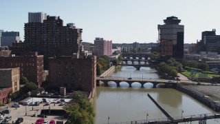 DX0002_206_036 - 5.7K aerial stock footage fly away from First Federal Plaza and bridges to reveal High Falls, Downtown Rochester, New York