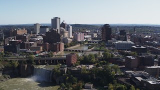 DX0002_206_037 - 5.7K aerial stock footage fly away from bridges and High Falls for view of skyline, Downtown Rochester, New York