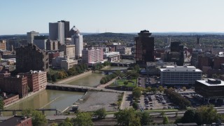 DX0002_206_041 - 5.7K aerial stock footage of passing Genesee River bridges and office tower, Downtown Rochester, New York