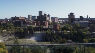 DX0002_207_001 - 5.7K aerial stock footage fly away from skyline and bridges near the falls, Downtown Rochester, New York