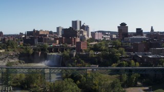 DX0002_207_002 - 5.7K aerial stock footage approach and flyby skyline and bridges near the falls, Downtown Rochester, New York