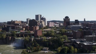 DX0002_207_009 - 5.7K aerial stock footage focus on skyline while flying past High Falls, Downtown Rochester, New York