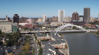DX0002_207_011 - 5.7K aerial stock footage of the skyline behind bridge over Genesee River, Downtown Rochester, New York