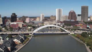 DX0002_207_012 - 5.7K aerial stock footage slowing approach bridge over Genesee River near skyline, Downtown Rochester, New York
