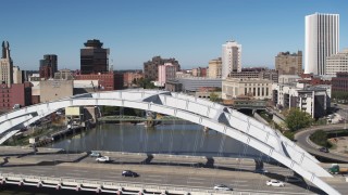 DX0002_207_020 - 5.7K aerial stock footage fly over Douglass-Anthony Bridge to reveal more bridges over Genesee River in Downtown Rochester, New York