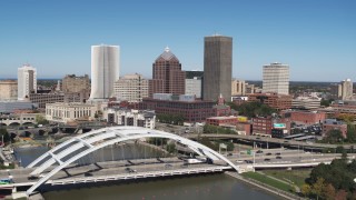 DX0002_207_022 - 5.7K aerial stock footage fly away from skyline to reveal Douglass-Anthony Bridge in Downtown Rochester, New York