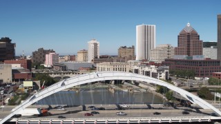 DX0002_207_029 - 5.7K aerial stock footage focus on high-rises while passing Douglass-Anthony Bridge, Downtown Rochester, New York