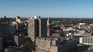 DX0002_208_004 - 5.7K aerial stock footage fly away from an apartment complex in Downtown Rochester, New York