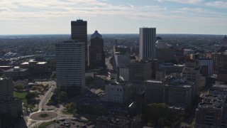 DX0002_208_012 - 5.7K aerial stock footage ascend and fly away from the city skyline, Downtown Rochester, New York