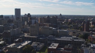 DX0002_208_016 - 5.7K aerial stock footage flyby office buildings and parking garage, Downtown Rochester, New York