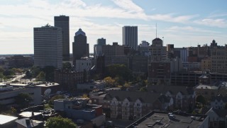 DX0002_208_020 - 5.7K aerial stock footage of the city skyline seen while ascending near Five Star Bank Plaza, Downtown Rochester, New York