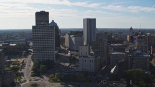 DX0002_208_021 - 5.7K aerial stock footage of the city skyline seen while flying near Five Star Bank Plaza, Downtown Rochester, New York