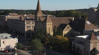 DX0002_208_024 - 5.7K aerial stock footage orbit and fly away from a church in Rochester, New York