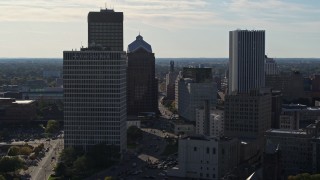DX0002_208_031 - 5.7K aerial stock footage of ascending past skyscrapers and office towers in Downtown Rochester, New York