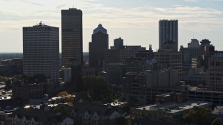 DX0002_208_034 - 5.7K aerial stock footage ascend while focused on skyscrapers and office towers in Downtown Rochester, New York