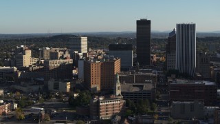 DX0002_209_003 - 5.7K aerial stock footage orbit apartment building near high-rises, Downtown Rochester, New York