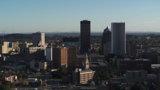 DX0002_209_011 - 5.7K aerial stock footage of apartment building and skyline during ascent, Downtown Rochester, New York