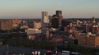 DX0002_209_029 - 5.7K aerial stock footage of focus on First Federal Plaza, flyby office buildings at sunset, Downtown Rochester, New York
