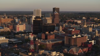 DX0002_209_030 - 5.7K aerial stock footage of First Federal Plaza, office buildings, radio tower at sunset, Downtown Rochester, New York