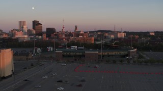 DX0002_209_047 - 5.7K aerial stock footage a stationary view of the baseball stadium at sunset, Downtown Rochester, New York