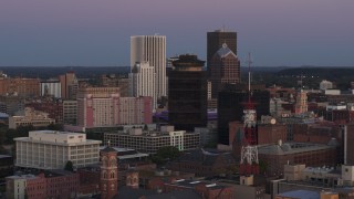 DX0002_210_001 - 5.7K aerial stock footage of flying by First Federal Plaza and office buildings at twilight, Downtown Rochester, New York